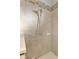 Clean shower with tiled walls and a rainfall shower head at 9973 Holopaw St, Englewood, FL 34223