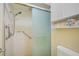 Large walk-in shower with grab bars and linen storage at 1402 Grand Blvd # 240, Sarasota, FL 34232