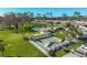 Aerial view of community amenities including shuffleboard, pool, and clubhouse at 1402 Grand Blvd # 240, Sarasota, FL 34232