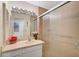 Clean bathroom with a walk-in shower and updated vanity at 1402 Grand Blvd # 240, Sarasota, FL 34232