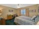 Bright bedroom featuring a comfortable bed and workspace at 1402 Grand Blvd # 240, Sarasota, FL 34232
