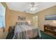 Spacious bedroom with a queen-size bed and built-in shelving at 1402 Grand Blvd # 240, Sarasota, FL 34232