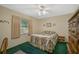 Bedroom with double bed, dresser, and ceiling fan at 1402 Grand Blvd # 240, Sarasota, FL 34232
