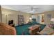 Relaxing living room, green carpet, and a view of the kitchen at 1402 Grand Blvd # 240, Sarasota, FL 34232