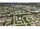 Aerial view of community, showing homes, streets, and ocean at 1402 Grand Blvd # 240, Sarasota, FL 34232