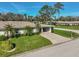 Single story home with carport, landscaping, and a mailbox at 1402 Grand Blvd # 240, Sarasota, FL 34232