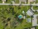 Community pool and shuffleboard courts are seen from above at 1402 Grand Blvd # 240, Sarasota, FL 34232