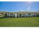 Ranch style home showcasing a lush green lawn at 1402 Grand Blvd # 240, Sarasota, FL 34232