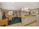 Kitchen with granite countertops and white cabinetry at 1402 Grand Blvd # 240, Sarasota, FL 34232