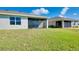 Home with screened patio and neighboring homes at 16058 Bridle Ridge St, Port Charlotte, FL 33953