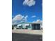 Cute light blue manufactured home with carport and landscaping at 359 Longwood Dr, Venice, FL 34285