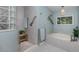 Spa-like bathroom with soaking tub, walk-in shower and updated finishes at 147 Tampa E Ave # 202, Venice, FL 34285