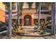 Building entrance with landscaped walkway at 147 Tampa E Ave # 202, Venice, FL 34285