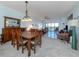 Bright dining room features a large wooden table and chairs, perfect for entertaining at 147 Tampa E Ave # 202, Venice, FL 34285