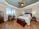 Main bedroom with hardwood floors, water views, and ample natural light at 147 Tampa E Ave # 202, Venice, FL 34285