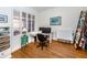 Bright home office features built-in shelving and hardwood floors at 147 Tampa E Ave # 202, Venice, FL 34285