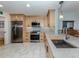 Modern kitchen with stainless steel appliances and ample cabinet space at 147 Tampa E Ave # 202, Venice, FL 34285