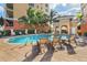 Inviting community pool with comfortable lounge chairs at 147 Tampa E Ave # 202, Venice, FL 34285