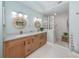 Modern bathroom with dual vanity, walk-in shower, and stylish fixtures at 147 Tampa E Ave # 202, Venice, FL 34285
