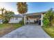 House exterior with carport and landscaping at 1023 Lillian St, Venice, FL 34285