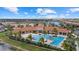 Resort-style community pool with expansive deck and lounge area at 11925 Bohemian Pl, Venice, FL 34293