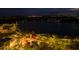 Night aerial view of a town center with lake and walkways at 11925 Bohemian Pl, Venice, FL 34293