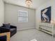 Bright office with a comfortable armchair and coastal decor at 11925 Bohemian Pl, Venice, FL 34293