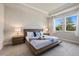 Spacious primary bedroom with wood platform bed at 11925 Bohemian Pl, Venice, FL 34293