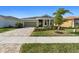 One-story home with attractive landscaping and driveway at 11925 Bohemian Pl, Venice, FL 34293