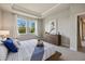 Bright bedroom with a dresser and large windows at 11925 Bohemian Pl, Venice, FL 34293