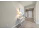 Bright and airy entryway with a console table and mirror at 11925 Bohemian Pl, Venice, FL 34293