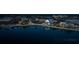 Night view of the community with lakefront, shops, and restaurants at 11925 Bohemian Pl, Venice, FL 34293