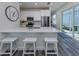 Modern kitchen with white cabinets, quartz countertops, and breakfast bar at 121 Clifton Way, Venice, FL 34292