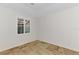Bedroom with a large window, tile floor and baseboard trim at 1219 Nantucket Rd, Venice, FL 34293