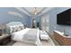 Stylishly staged bedroom featuring sliding glass doors leading to the lanai at 1219 Nantucket Rd, Venice, FL 34293