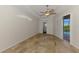 Spacious bedroom with sliding glass doors leading to the lanai and tile flooring at 1219 Nantucket Rd, Venice, FL 34293