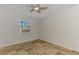 Bedroom with a ceiling fan, window and tile floor at 1219 Nantucket Rd, Venice, FL 34293
