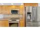 Close up of the kitchen featuring stainless steel appliances and mosaic backsplash at 1219 Nantucket Rd, Venice, FL 34293