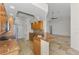 Spacious kitchen features granite counters and views of the Gathering room and backyard at 1219 Nantucket Rd, Venice, FL 34293