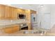 Kitchen with stainless steel appliances, granite countertops and a view of backyard at 1219 Nantucket Rd, Venice, FL 34293