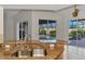 Granite countertop with stainless steel sink and backyard pool view through sliding glass doors at 1219 Nantucket Rd, Venice, FL 34293