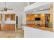 Open kitchen featuring granite countertops, stainless steel appliances, and light wood cabinets at 1219 Nantucket Rd, Venice, FL 34293