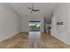Spacious living area featuring tile floors and sliding glass doors to the screened-in lanai at 1219 Nantucket Rd, Venice, FL 34293