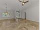 Bright living area boasts tile floors and features views of the dining room and front entry at 1219 Nantucket Rd, Venice, FL 34293