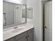 Bathroom with single vanity, and a large mirror at 12236 Stuart Dr, Venice, FL 34293