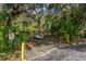 Small wooden dock with alligator warning sign at 1238 Waterside Ln, Venice, FL 34285