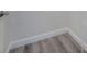 Close-up view of grey wood-look flooring at 125 Clifton Way, Venice, FL 34292