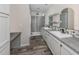 Modern bathroom with double vanity, walk-in shower, and stylish tile at 127 Nautical Dr, North Port, FL 34287