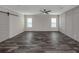 Bright bedroom with neutral walls, hardwood floors and barn door at 127 Nautical Dr, North Port, FL 34287
