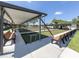 Outdoor bocce ball court with benches and shade covering at 127 Nautical Dr, North Port, FL 34287